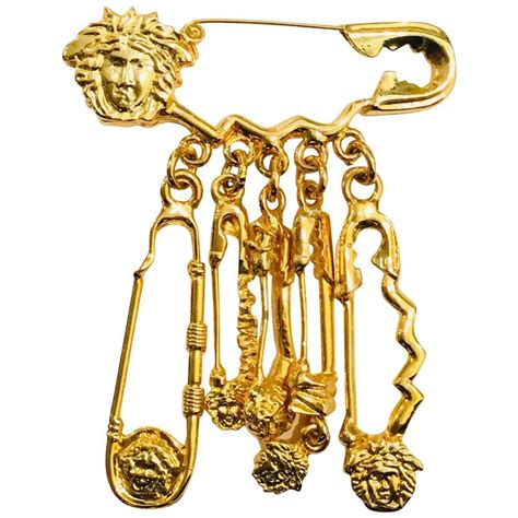 versace safety pins.